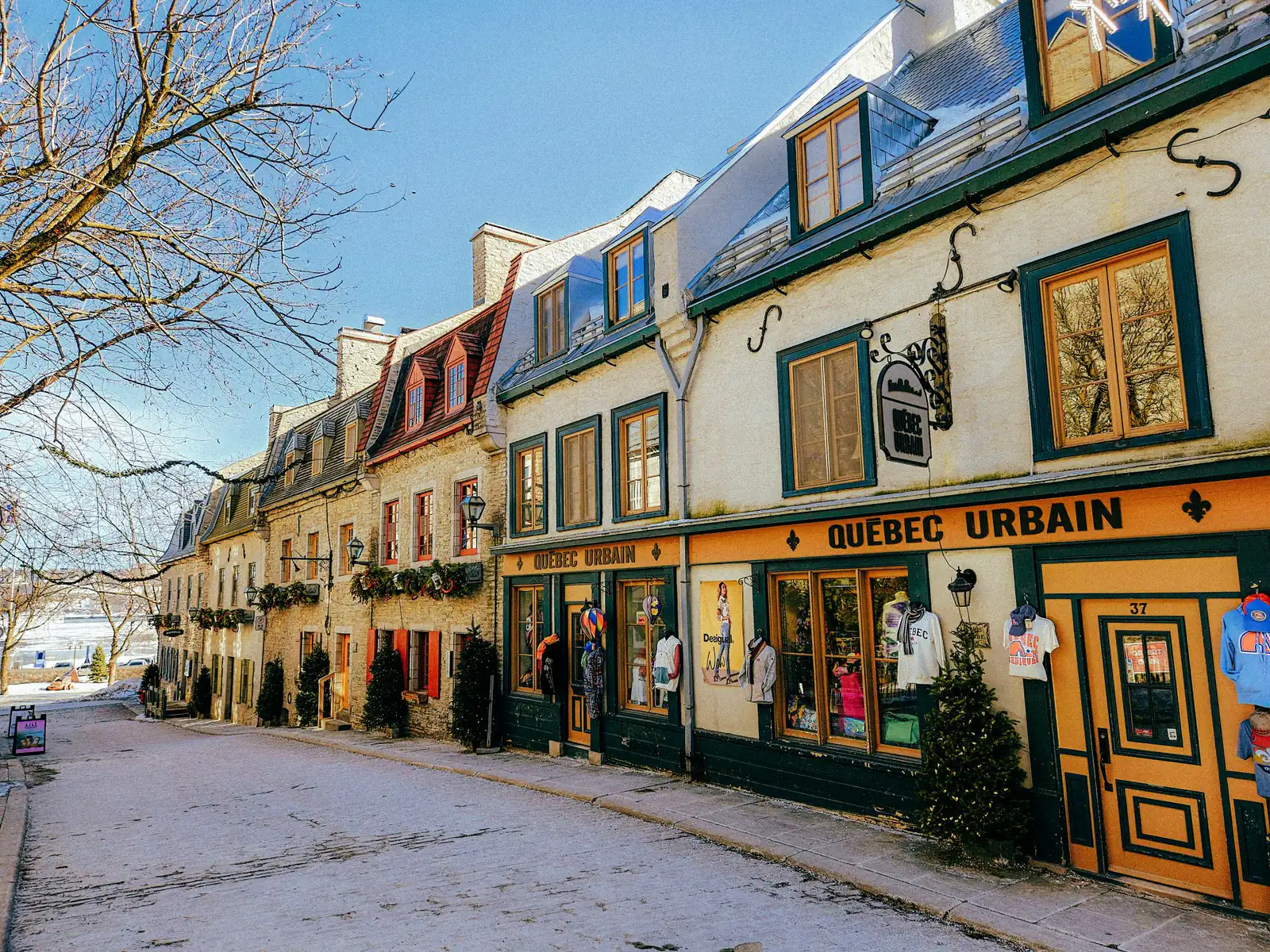 A colourful street of historic shops in Quebec City on a sunny winter day