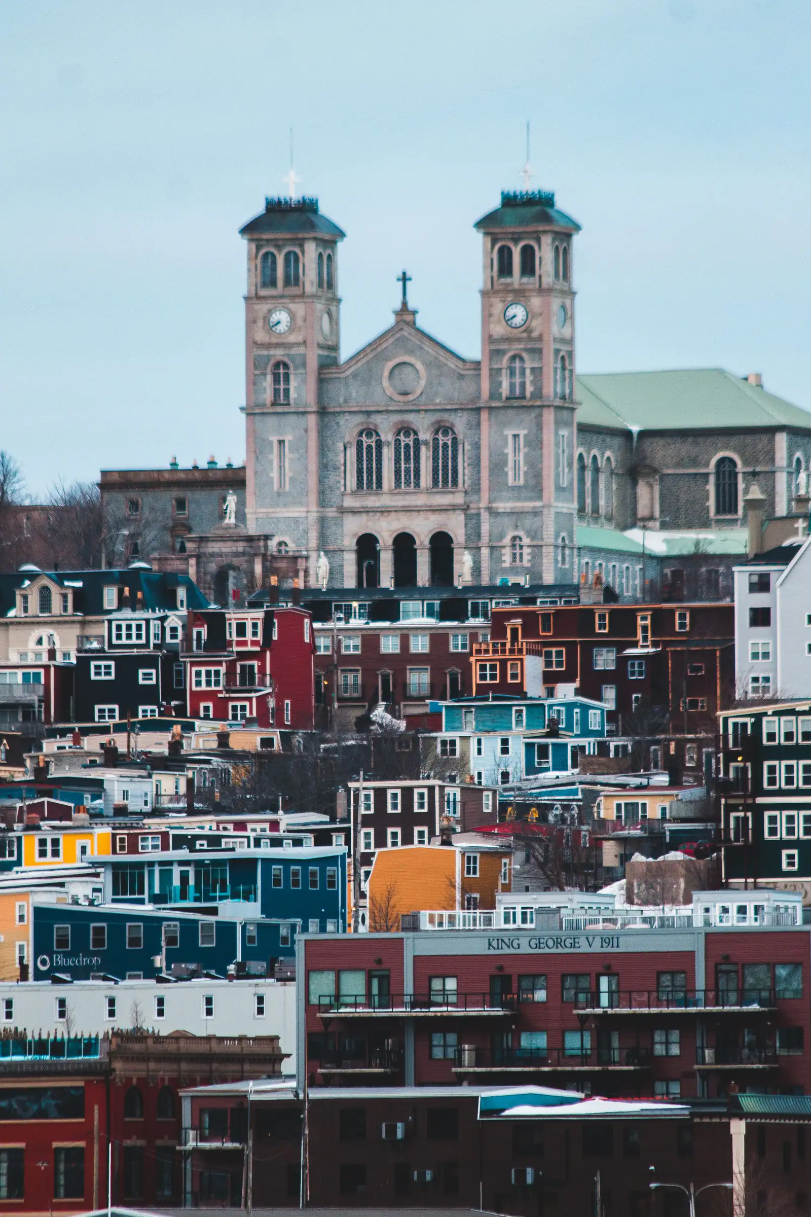 Colourful row houses climbing the hill below the basilica in St. John’s, Newfoundland